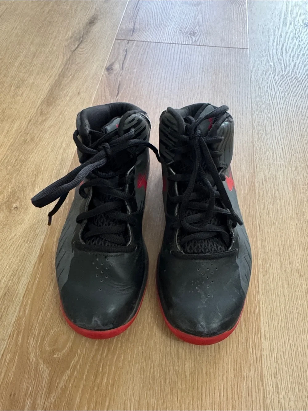 Under Armour red and black boys basketball shoes. Size 1Y.